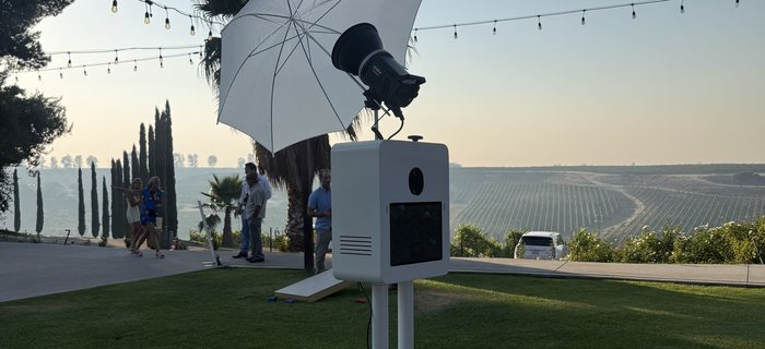 The booth plugged in on an outdoor deck at golden hour